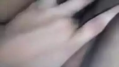 Horny Desi gal displays saggy tits and also fingers her XXX cunny