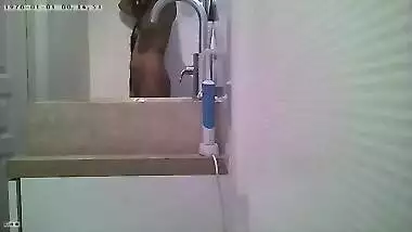 Unsuspecting Indian girl takes shower without knowing about camera