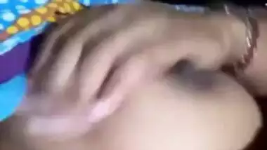 Pretty Desi MILF poses for the camera and teases with big XXX tits