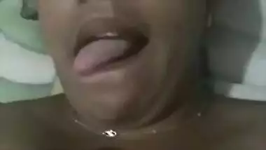 Indian aunty with sexy full lips takes big natural boobs out in bed