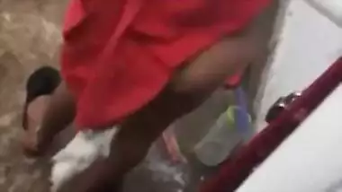 MILF dries hair and body outdoors being filmed by an Indian perv