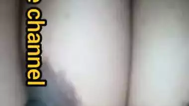 Naughty Desi woman squeezes tits to lick nipples in the porn video