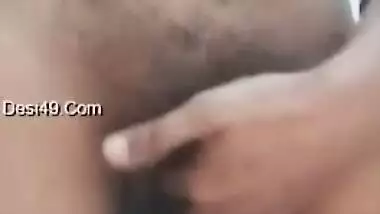 Big-tittied Desi gal strips and XXX pleases herself with fingering