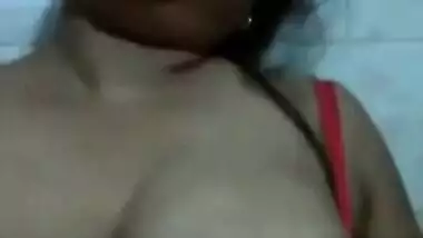 Desi love leans against the wall and takes her XXX boobs out of sex bra