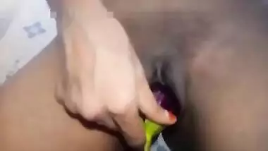 Indian girl plays XXX games on camera shoving an eggplant in her sex hole