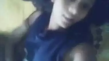 Teen Desi beauty holds the camera and shows off her shaved XXX twat