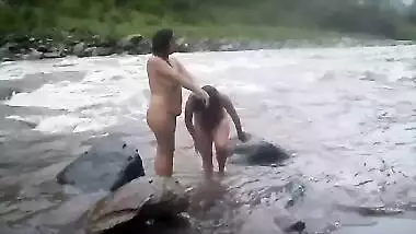 Two fat Desi women show their XXX assets while relaxing naked in river