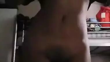 Come-hither Indian female performs XXX striptease in front of the camera