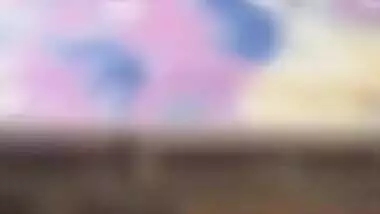 Desi mom with serious face sits before camera topless in solo sex clip