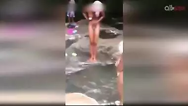 Lewd amateur Desi aunty flashing her nice big tits while bathing outdoor