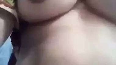 Desi fatty poses for the camera to reveal her big XXX boobs and slit