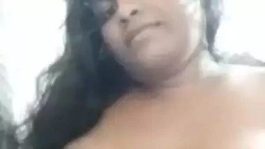 Long-haired Desi hussy takes top off to reveal her big XXX breasts